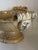 A beautifully handcrafted ceramic pedestal compote featuring an elegant sculptural silhouette with richly detailed scroll...