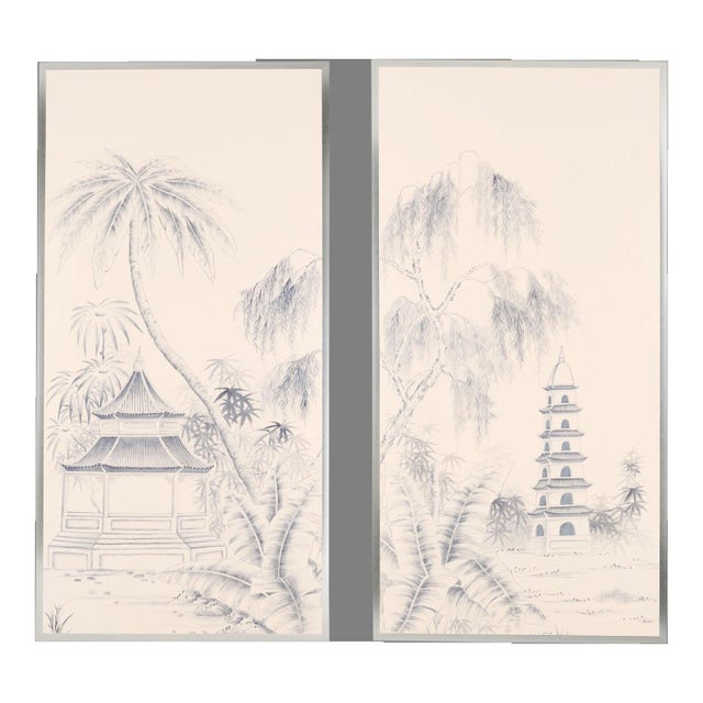 This hand painted chinoiserie-style wallpaper mural features an elegant blue and white landscape scene with traditional...