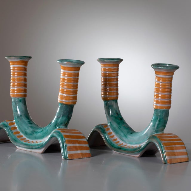 A rare and museum-quality pair of ceramic candle holders, produced by ICS (Industria Ceramica Salernitana) Vietri during...