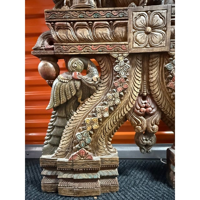 Presenting a magnificent, grand-scale pair of custom-commissioned Indian architectural hardwood sculptures, standing over...