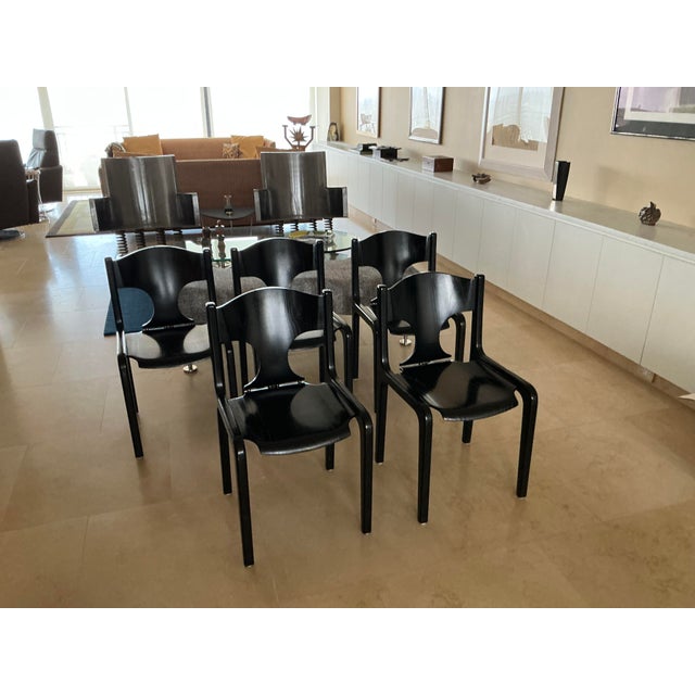 Hard to find original Black wooden Pozzi chairs designed by Savini, made in Italy, manufactured in the 1960s. Five chairs,...