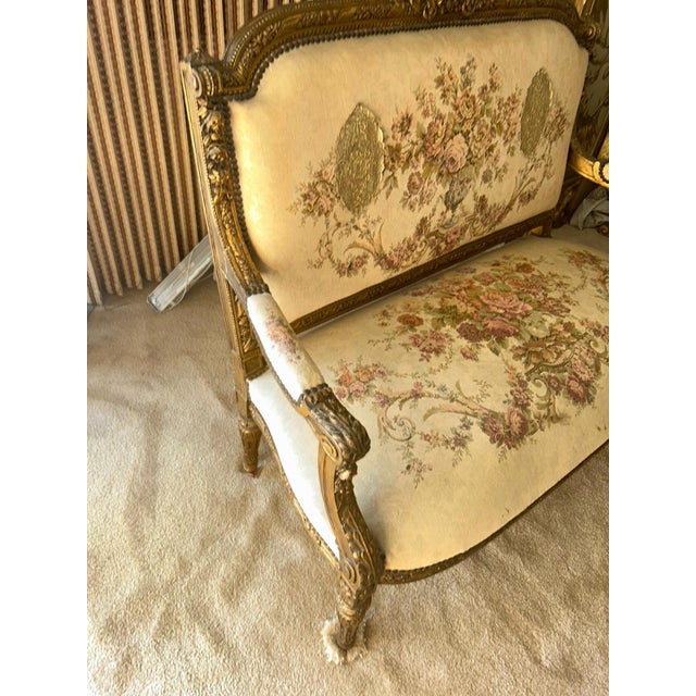 Elegant two-seat sofa with carved wood frame and classic Louis XIV design. Rich detailing on the arms and legs. A...