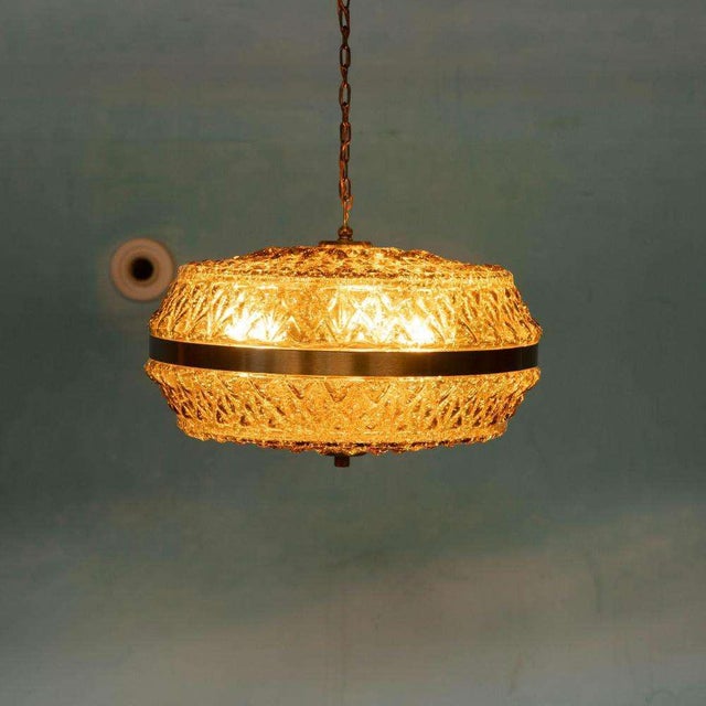 Unique Scandinavian hanging lamp in ocher glass - an attractive eye-catcher for your interior. This impressive amber-...