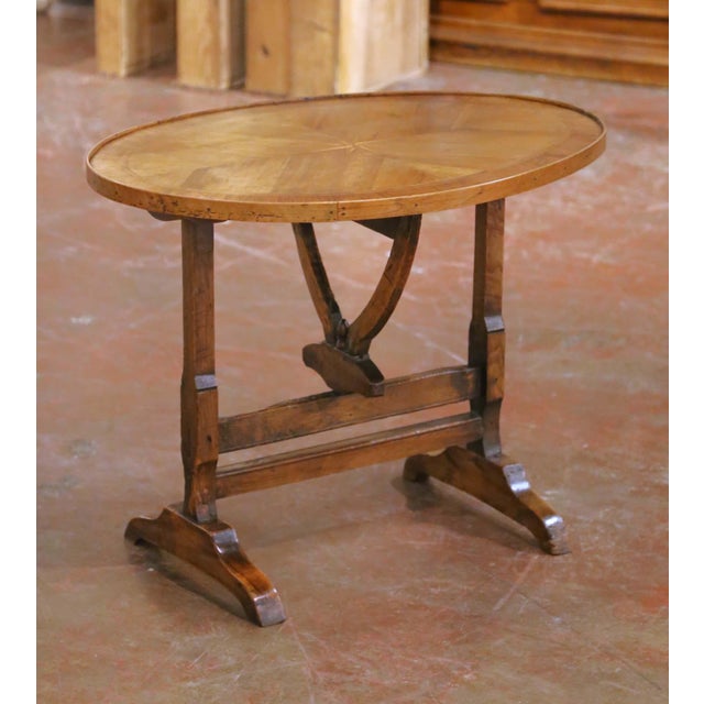 This refined antique wine tasting table was crafted in France circa 1880 and executed in richly patinated walnut. Designed...