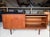 In good used condition with minor age related signs of use. This stunning Mid Century Danish Modern Teak Credenza...