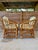 A charming pair of vintage Henry Link pencil rattan lounge chairs featuring the iconic sculptural frame and original...