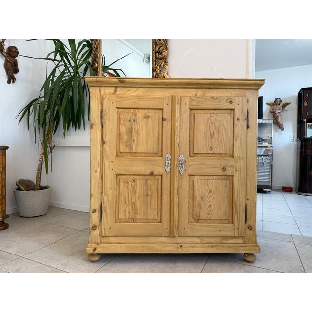 Dreamy Biedermeier vertico/cabinet made of spruce wood. Dimensions: Height x Width x Depth 125 x 120 x 45 cm. For sale is...
