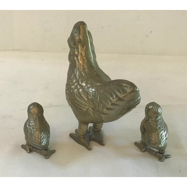 Nice brass hen with two chick! Measurements below of hen.