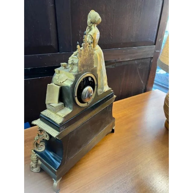 This antique French mantle clock has a timeless appeal that will add a touch of elegance to any room. Crafted from high-...