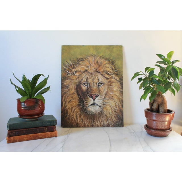 Vintage unframed lion head painting on board. Signed and dated bottom right. Some age wear. Pictured.