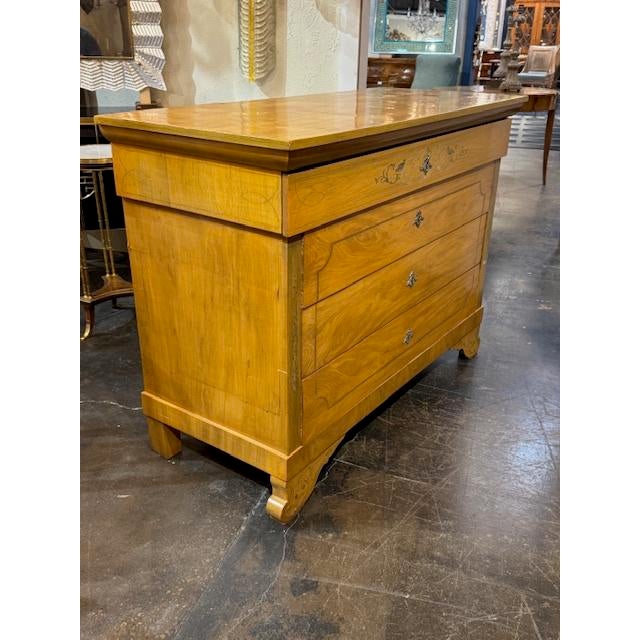 Late 19th century French Charles X blonde oak commode with silver inlay. A late‑19th‑century French Charles X commode in...