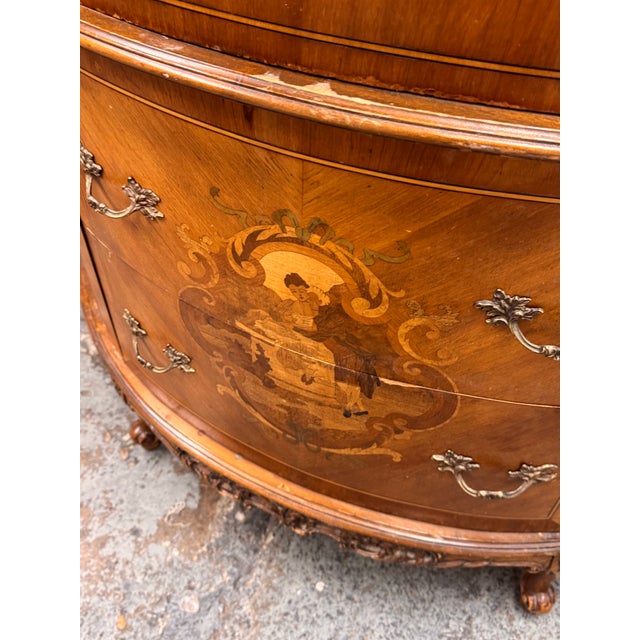 Design Plus Gallery presents a Neoclassical Semicircular Demi-Lune Commode. The commode has a shaped marble top above a...