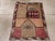 A vintage Turkish Anatolian pictorial rug. A mosque and minaret stand in the upper half of the field. An “Allah”...