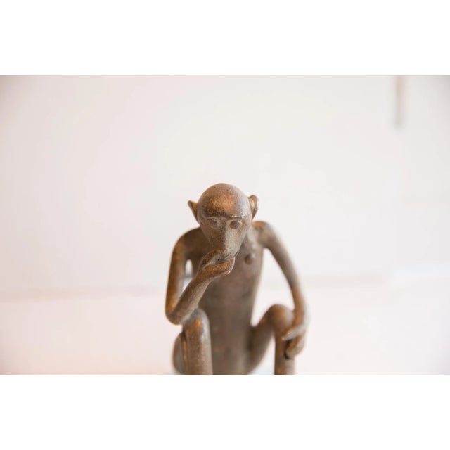 :: Vintage handmade African sitting monkey figurine. Circa late mid 20th century, though possibly older, this piece has...