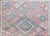 A chic and quiet early 20th century Persian Baluch rug with a central diamond medallion surrounded by a geometric pattern...
