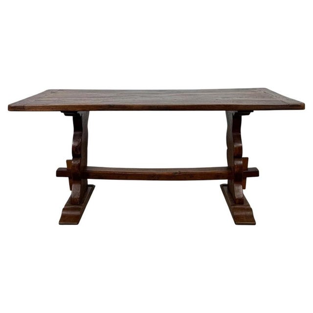 An exceptional 18th-century English Georgian refectory-style dining table, finely constructed from oak and distinguished...
