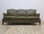 An elegant leather Chesterfield sofa, produced in the 1960s and 1970s. Covered with natural green leather. The sofa is...