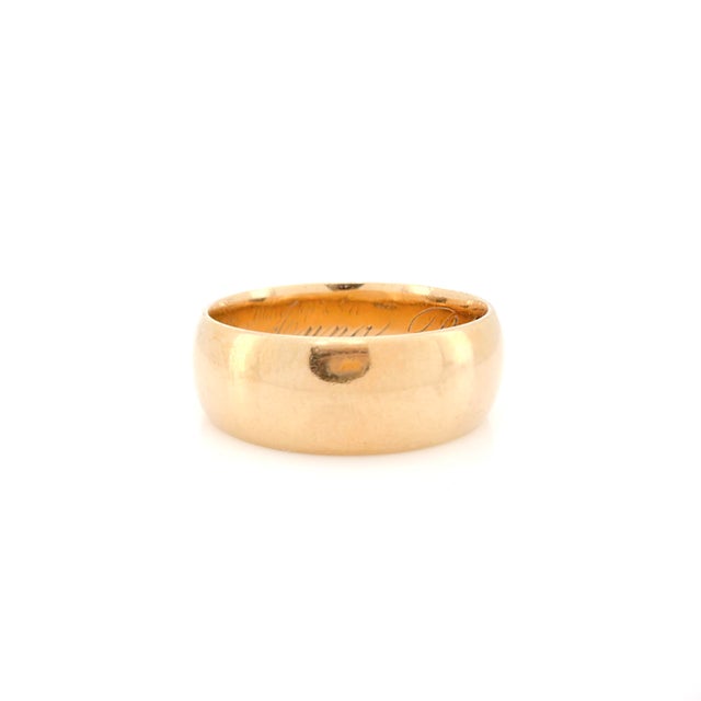 About This Ring: Step into the world of sentimental jewelry with this classic Victorian gold band featuring a rich patina....