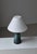 Sculptural and richly textured, this unique Scandinavian Modern 1960s table lamp by Sejer exemplifies the refined...