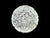 A luminous Waterford crystal paperweight with a rounded, faceted profile, cross-cut diamond detailing, and a starburst-cut...