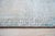 A hand-knotted wool rug, made in India and measuring 9' x 12'. Loose, abstract drawing rather than a formal repeating...