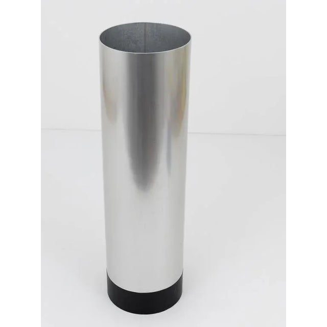 A beautiful cylindric Mid-Century umbrella stand, made of aluminum with a solid black metal base from Austria, 1960s,...