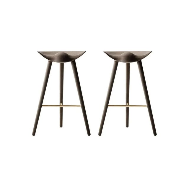 Set of 2 brown oak and brass bar stools by lassen dimensions: h 77 x w 36 x l 55.5 cm materials: oak, brass in 1942 mogens...