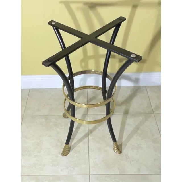 Mid-century modern decorative table base ,brass feet with elegant two brass-bends around Made in the mid 20th century,...