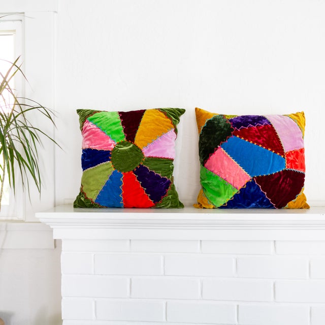 A bright pair of velvet crazy quilt pillows feature vibrant, multi-colored pieces of velvet patchwork with decorative...