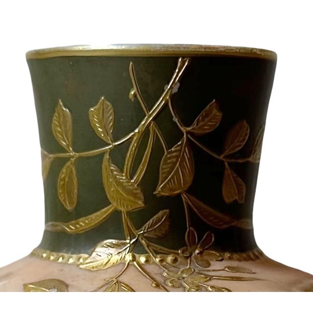 Antique art glass Hinrich's cream melon ware vase. It is beautifully decorated with golden flowers. Has original label at...