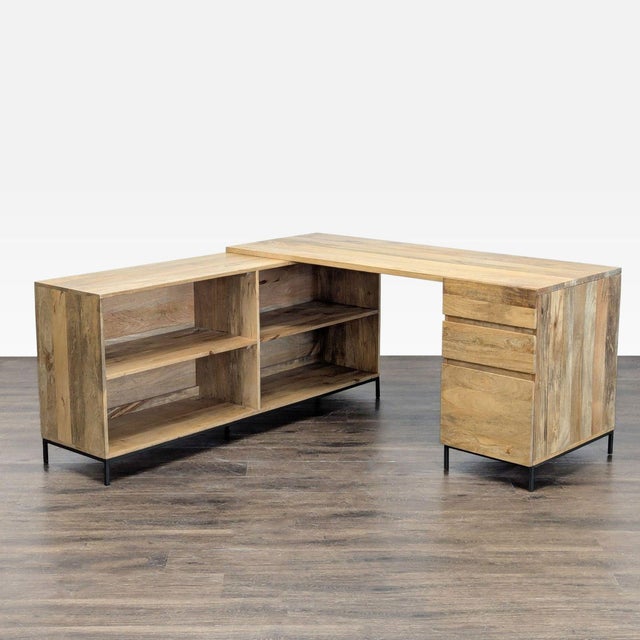 This stylish L-shaped desk from West Elm features a natural wood finish and a modern design. It offers plenty of workspace...