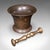 This is an antique apothecary mortar and pestle. An English, bronze kitchen or chemist's instrument with Tudor Rose motif,...