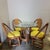 1950’s-60’s Mid-Century rattan and wood dining set having 4 swivel chairs with original yellow upholstery and a matching...
