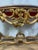 Console tables are characterized by their narrow depth and often ornate designs. This table's elaborate carvings and...