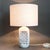 Decorative italian ceramic table lamp by guido gambone (circa 1950s). The piece is hand painted in a soft, milky white...