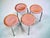 An original set of four postwar stools with a very distinctive, minimalist design. The stools feature contoured, slightly...