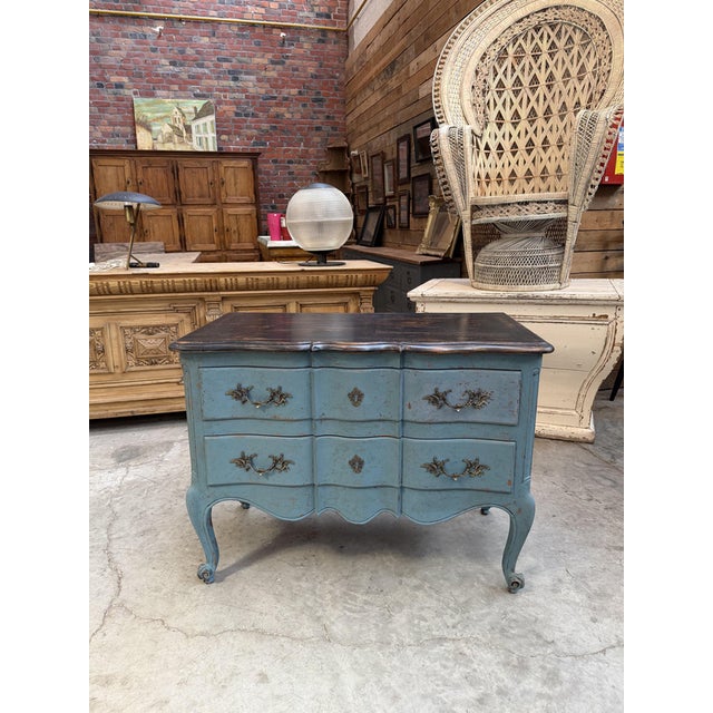 This 1940s chest of drawers has been completely restored. It features two large, functional drawers accented with bronze...