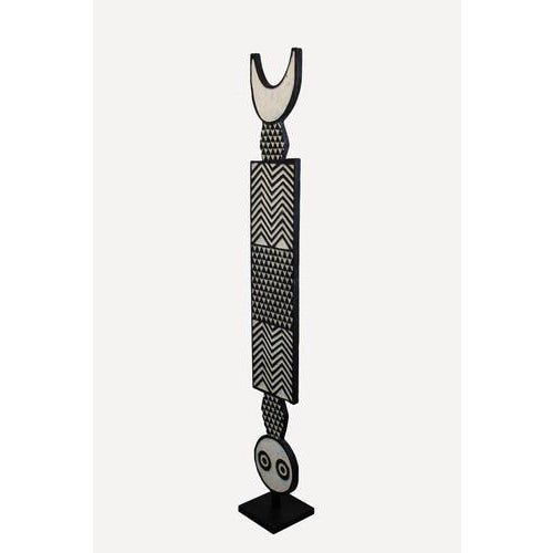 This striking bobo plank mask is a magnificent example of the abstract, rhythmic artistry of the bobo people from burkina...