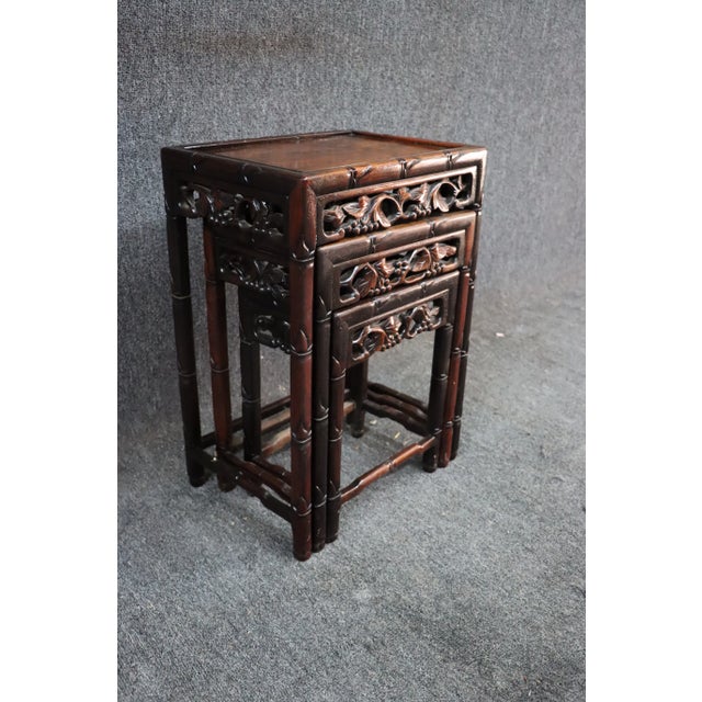 Asian style carved nesting tables in rosewood