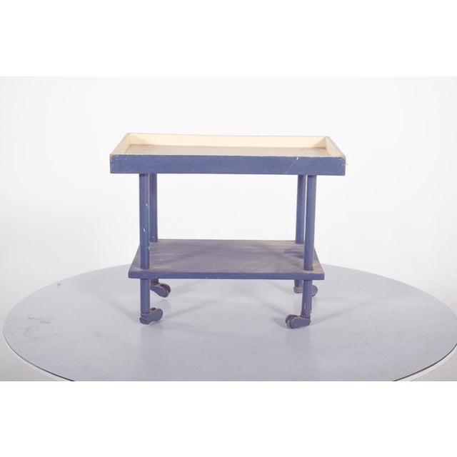 This charming children’s toy tea trolley from the 1950s is crafted in wood and painted in two tones, blue and cream. It...