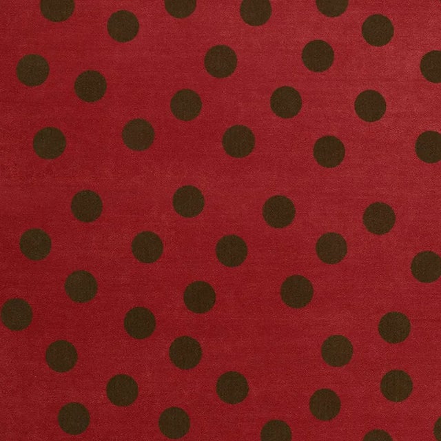 The Black Cherry Rug stands out with a rectangular shape in deep red, accented by playful dark dots. Like a sweet fruit,...