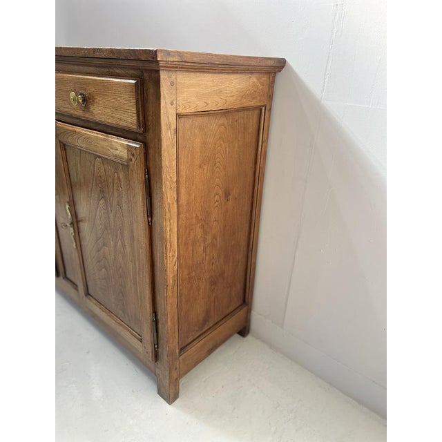 Parisian buffet in solid ash wood Two doors and three drawers on the front Good overall condition Dimensions: H 112 x W...