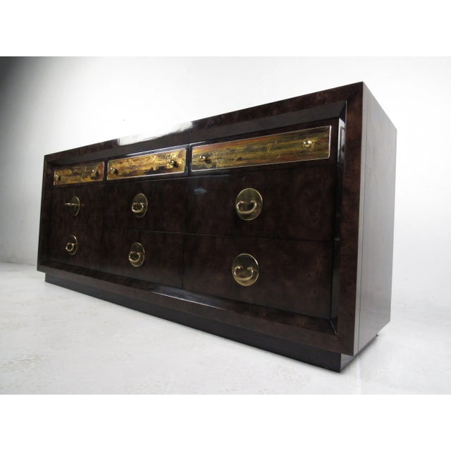This Mastercraft dresser features acid-etched designs, unique brass pulls, and quality vintage construction. Wonderful...