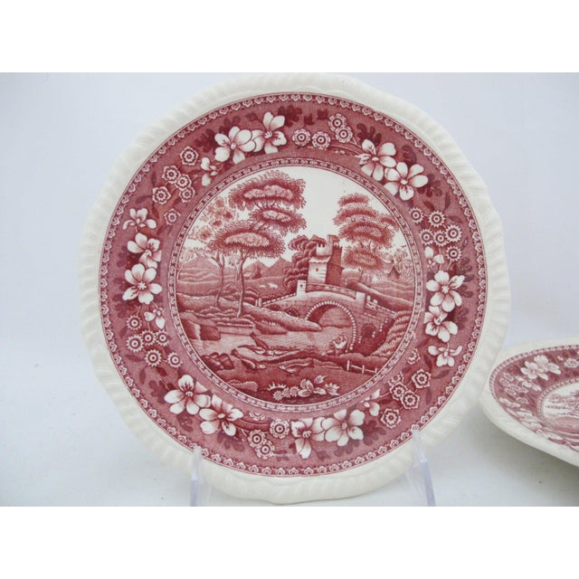 Spode Tower pink (red) transferware plate featuring a pastoral bridge and tower scene with a floral border Each measures 7...