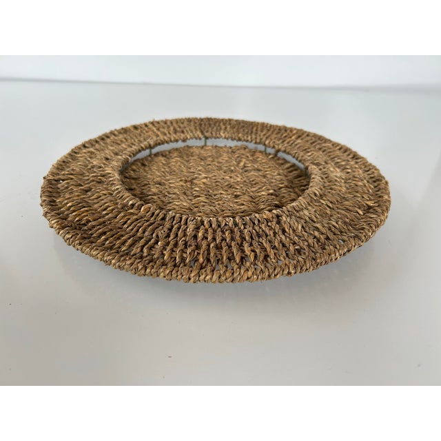 Set of 8 seagrass, circular table mats, woven around a metal frame so plate or bowl rests within charger.