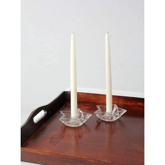 This is a pair of vintage star shaped glass candlestick holders. The mid-century cut glass candle holders hold a standard...