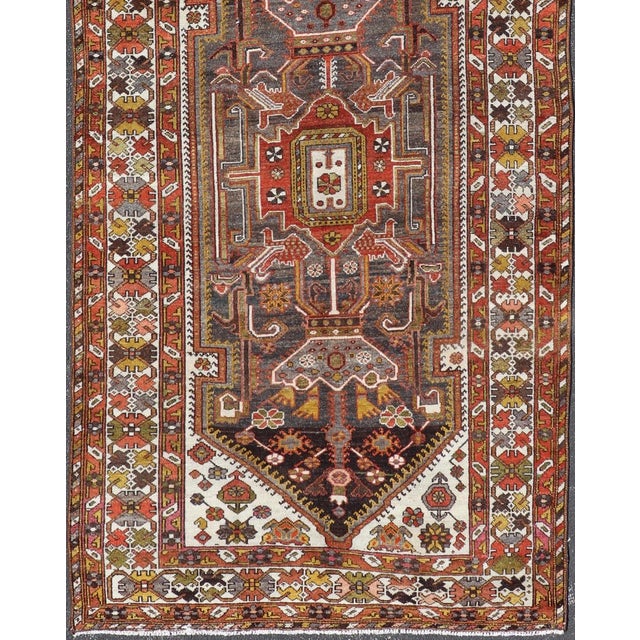 Measures: 5'6 x 13'8. Antique Persian Bakhtiar Gallery Rug Featuring a Multi-Medallion Tribal Design. Keivan Woven Arts /...