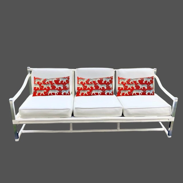 Vinatge 1970s sofa from Four Seasons Rattan co in NY made from thick Rattan or bamboo accented with chrome color metal...