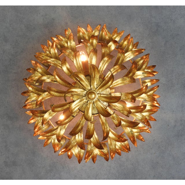 Spanish Mid-Century Gilt Iron Foliage Flush Mount Light, circa 1950s A striking Spanish mid-century flush mount light,...