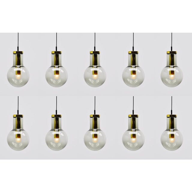 Very nice pendant lamps model Maxi Globe designed and made by Raak Amsterdam, The Netherlands 1965. These pendants have a...